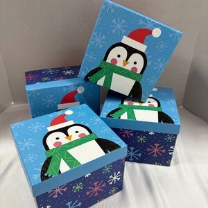 Christmas gift boxes with penguin design. Set of 4.